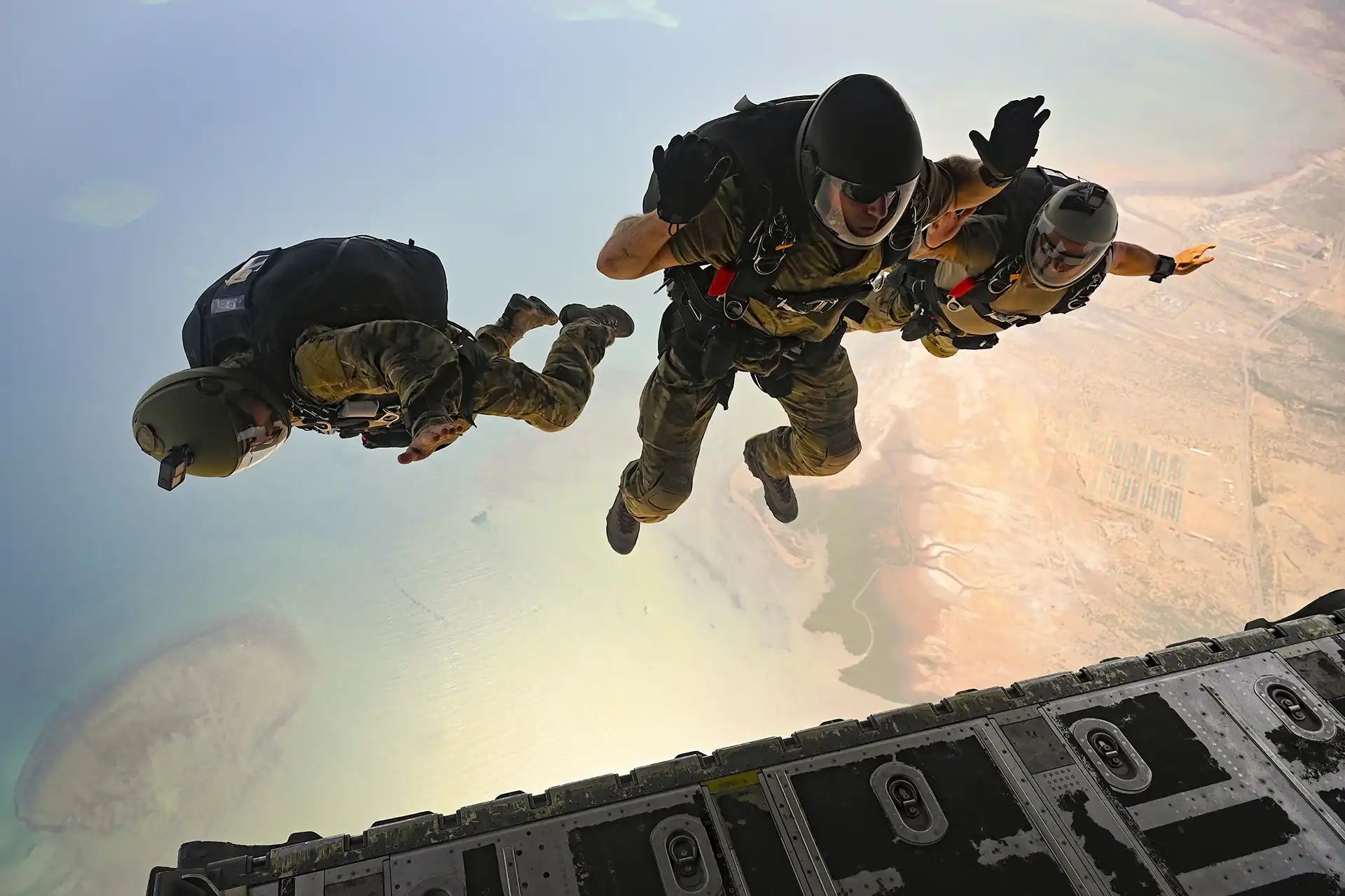 Airmen in military free fall after exiting a C-130J